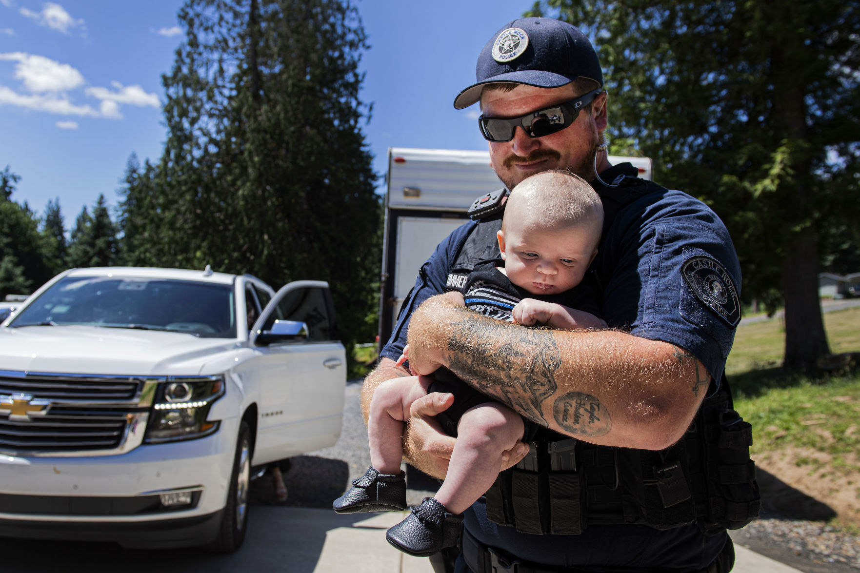 Bill Zimmerman holds son